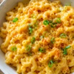 macaroni hacks — creamy upgraded boxed mac and cheese in a white bowl with green onions and smoked paprika