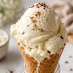 Keto cottage cheese ice cream in a waffle cone with creamy vanilla texture and chocolate shavings