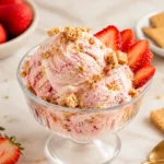 Strawberry Cottage Cheese Ice Cream with graham cracker swirl, fresh strawberries, and creamy cheesecake-style scoops.