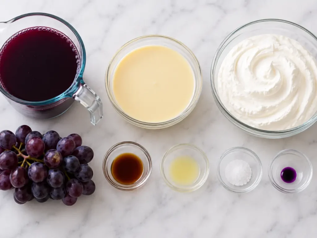 Ingredients for grape ice cream recipe with grape juice, condensed milk, whipped cream, vanilla, lemon juice, salt, and grapes