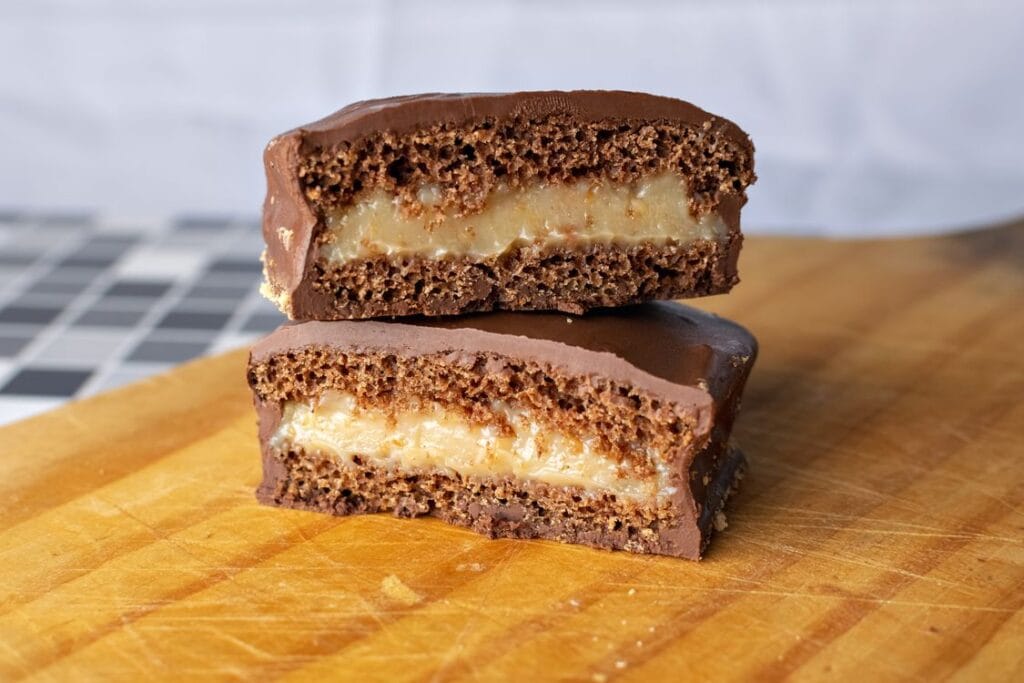 Fudgy chocolate brownie cake slices on a wooden board