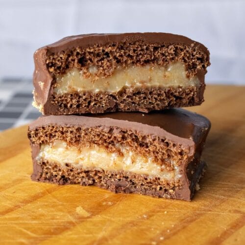 Fudgy chocolate brownie cake slices on a wooden board