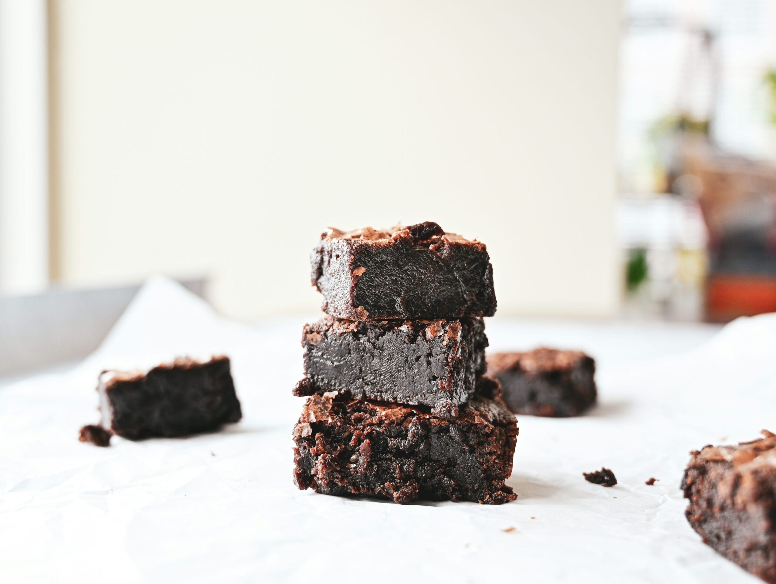 Chocolate brownie cake batter and finished slices showing a dense, fudgy crumb texture